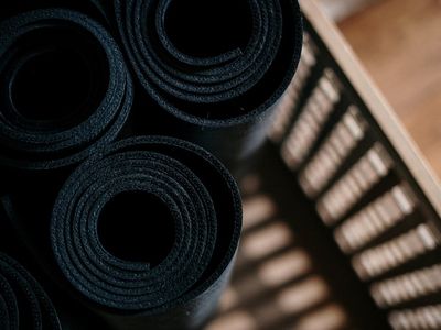 Close up of yoga blocks and rolled mat